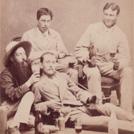 Four men drinking beer